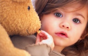 getty_rf_photo_of_toddler_feeding_teddy_bear_2